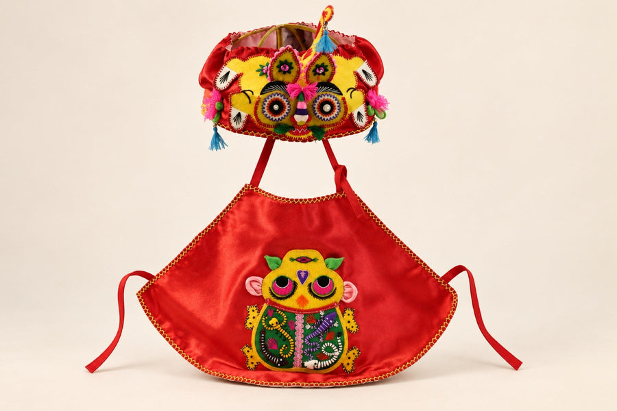 Studio product photograph of a handmade tiger hat ensemble